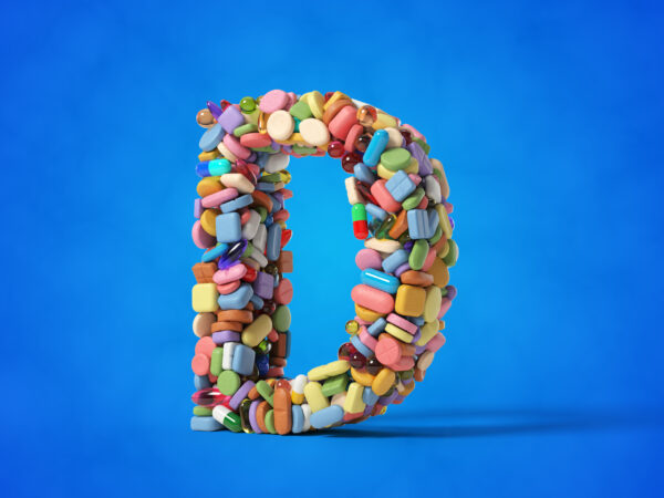 different pills stack in shape of letter D. suitable for medicine, healthcare and science themes. 3D illustration with blue background.