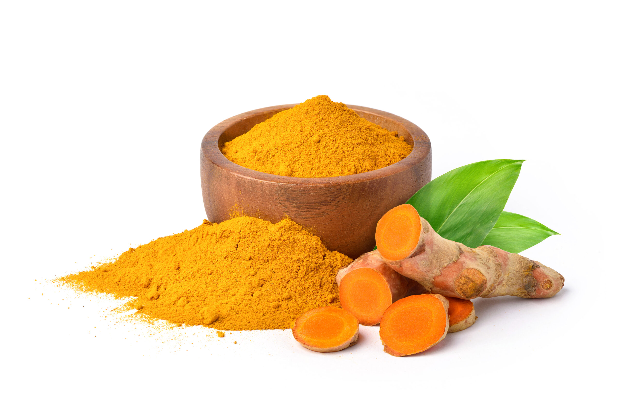 Finely dry Turmeric (Curcuma longa Linn) powder in wooden bowl with rhizome (root) slices and leaves isolated on white background.